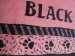 Strandlaken 87x177 cm "Black Panther" zwart en roze jacquard 100% katoen